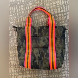 Haute Shore camo purse with bright pink and orange straps.
